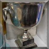 D27. Silver tone decorative urn. 